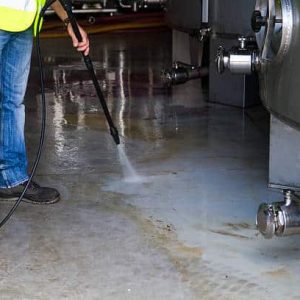 man washing around the industrial site